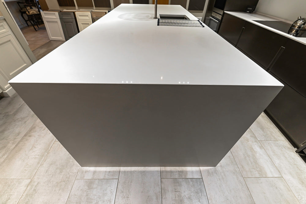 Composit Modern Brown Kitchen with Waterfall Island, Stone Countertops and Wolf & Sub-Zero Appliances