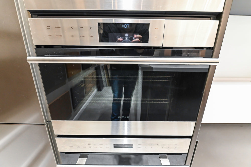 Composit Modern Brown Kitchen with Waterfall Island, Stone Countertops and Wolf & Sub-Zero Appliances