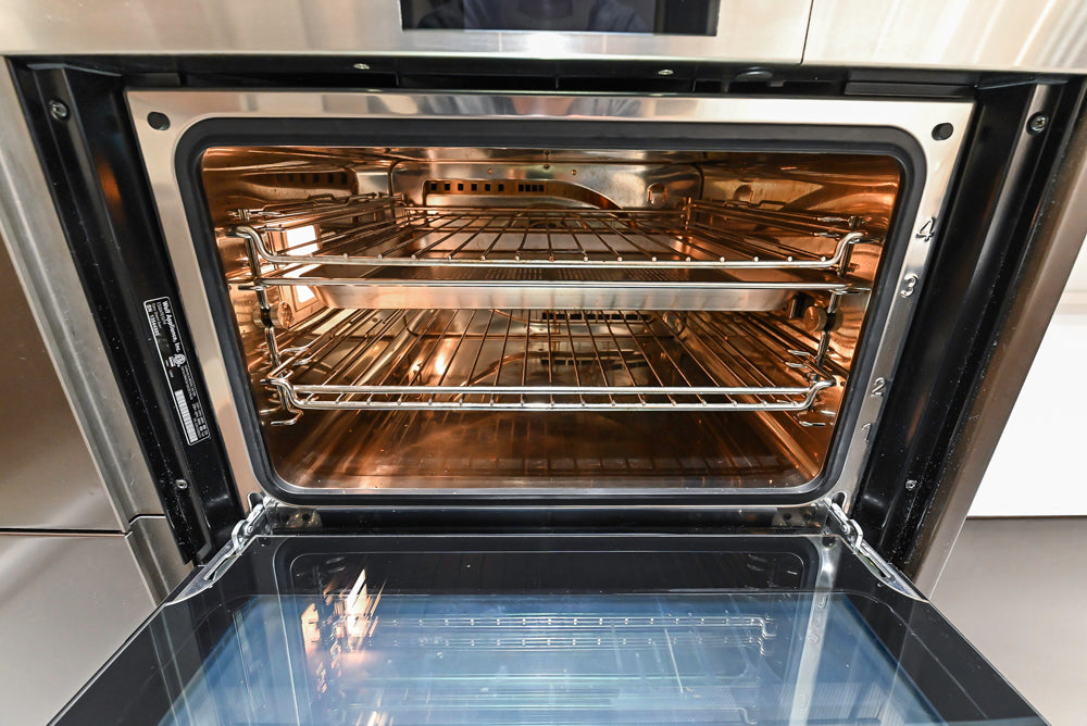Composit Modern Brown Kitchen with Waterfall Island, Stone Countertops and Wolf & Sub-Zero Appliances