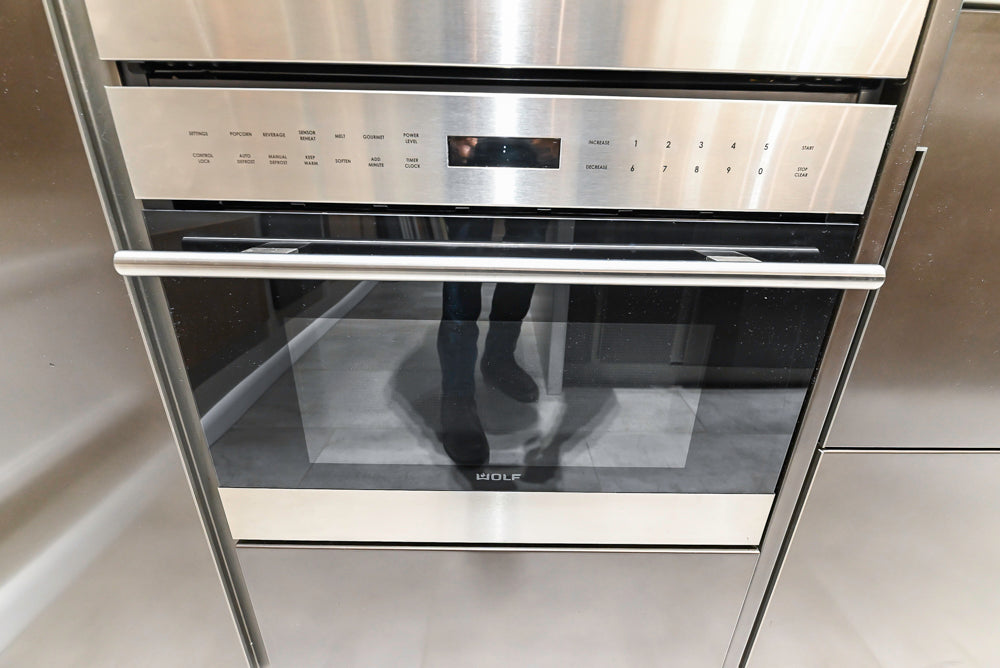 Composit Modern Brown Kitchen with Waterfall Island, Stone Countertops and Wolf & Sub-Zero Appliances