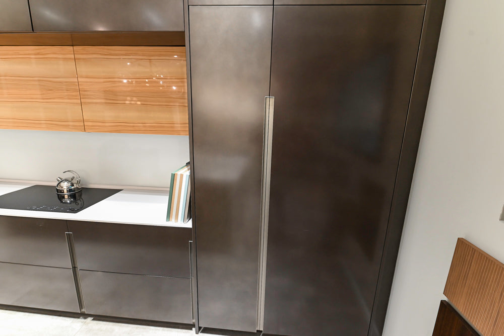 Composit Modern Brown Kitchen with Waterfall Island, Stone Countertops and Wolf & Sub-Zero Appliances