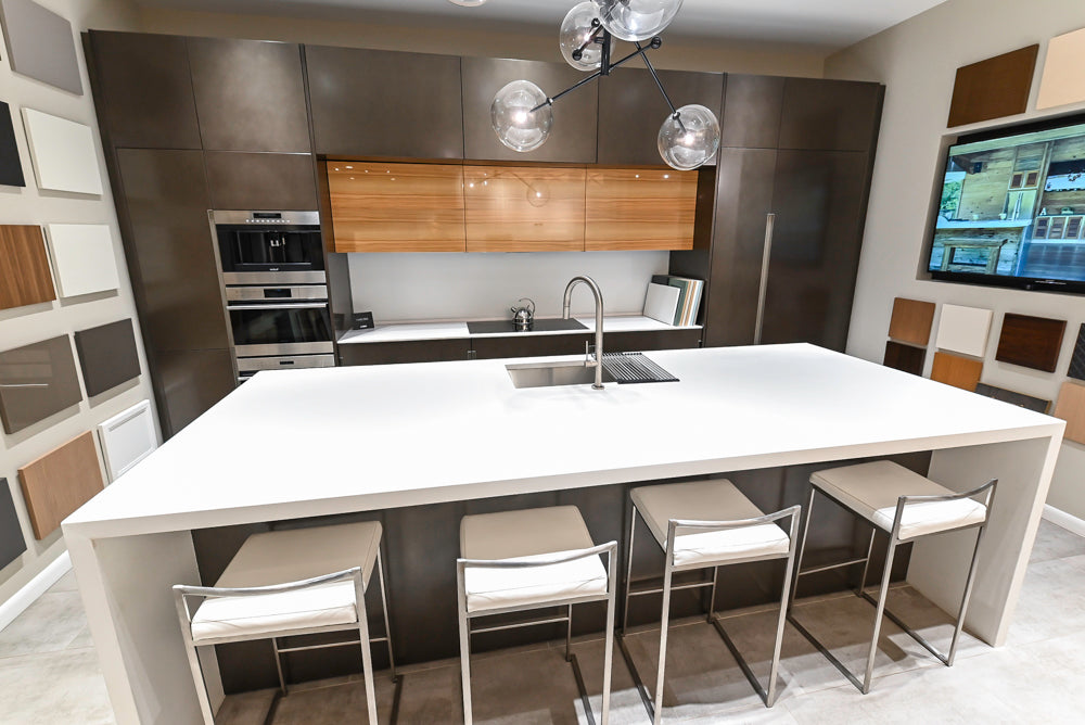 Composit Modern Brown Kitchen with Waterfall Island, Stone Countertops and Wolf & Sub-Zero Appliances