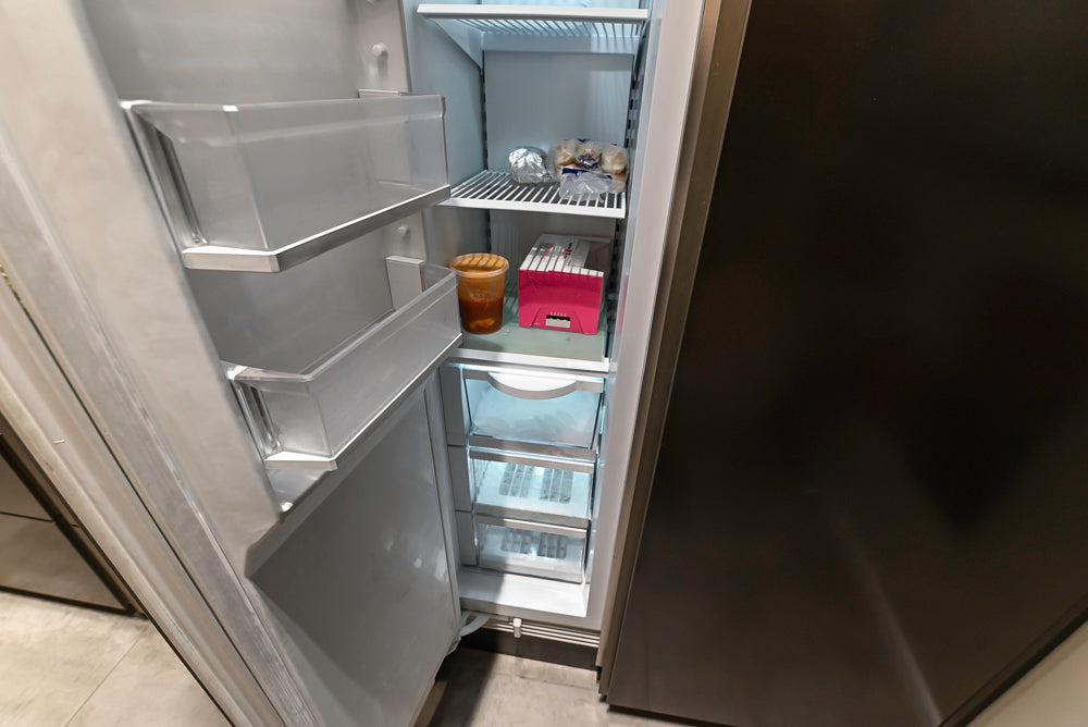 Composit Modern Brown Kitchen with Waterfall Island, Stone Countertops and Wolf & Sub-Zero Appliances