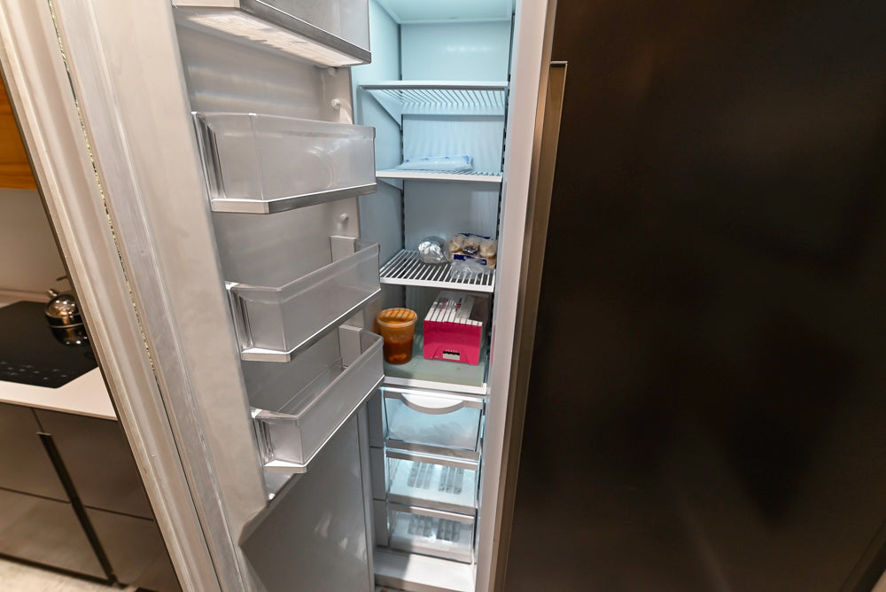 Composit Modern Brown Kitchen with Waterfall Island, Stone Countertops and Wolf & Sub-Zero Appliances