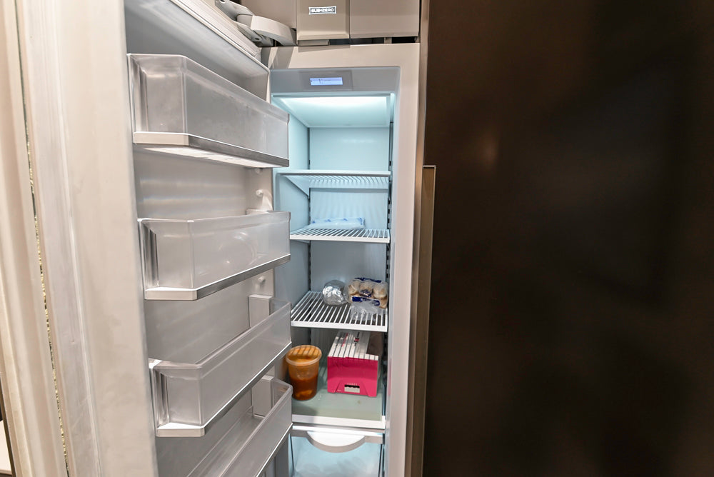 Composit Modern Brown Kitchen with Waterfall Island, Stone Countertops and Wolf & Sub-Zero Appliances