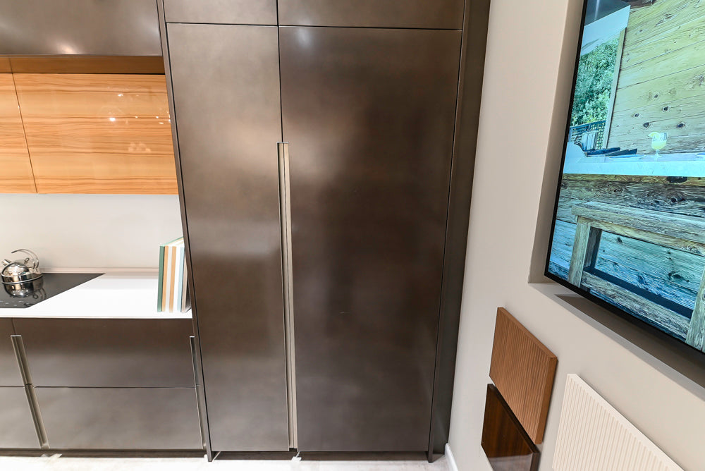 Composit Modern Brown Kitchen with Waterfall Island, Stone Countertops and Wolf & Sub-Zero Appliances