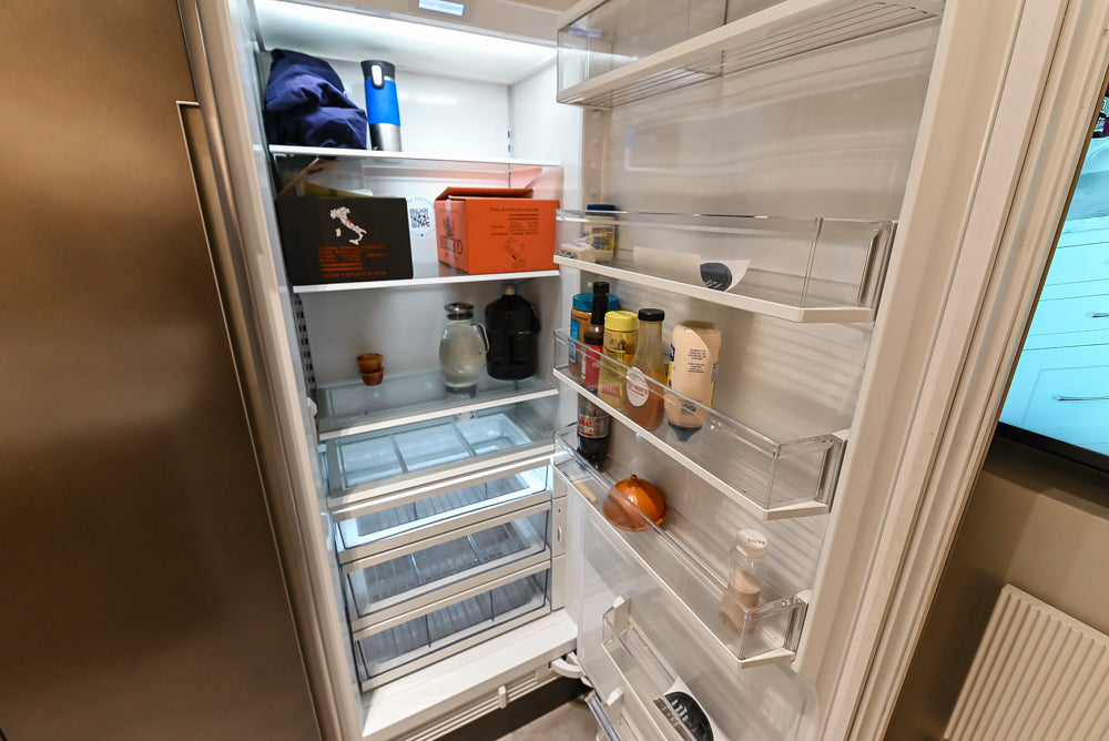 Composit Modern Brown Kitchen with Waterfall Island, Stone Countertops and Wolf & Sub-Zero Appliances