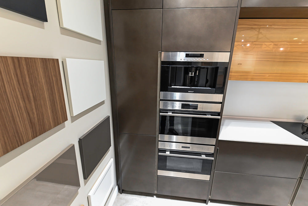 Composit Modern Brown Kitchen with Waterfall Island, Stone Countertops and Wolf & Sub-Zero Appliances