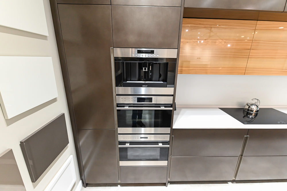 Composit Modern Brown Kitchen with Waterfall Island, Stone Countertops and Wolf & Sub-Zero Appliances