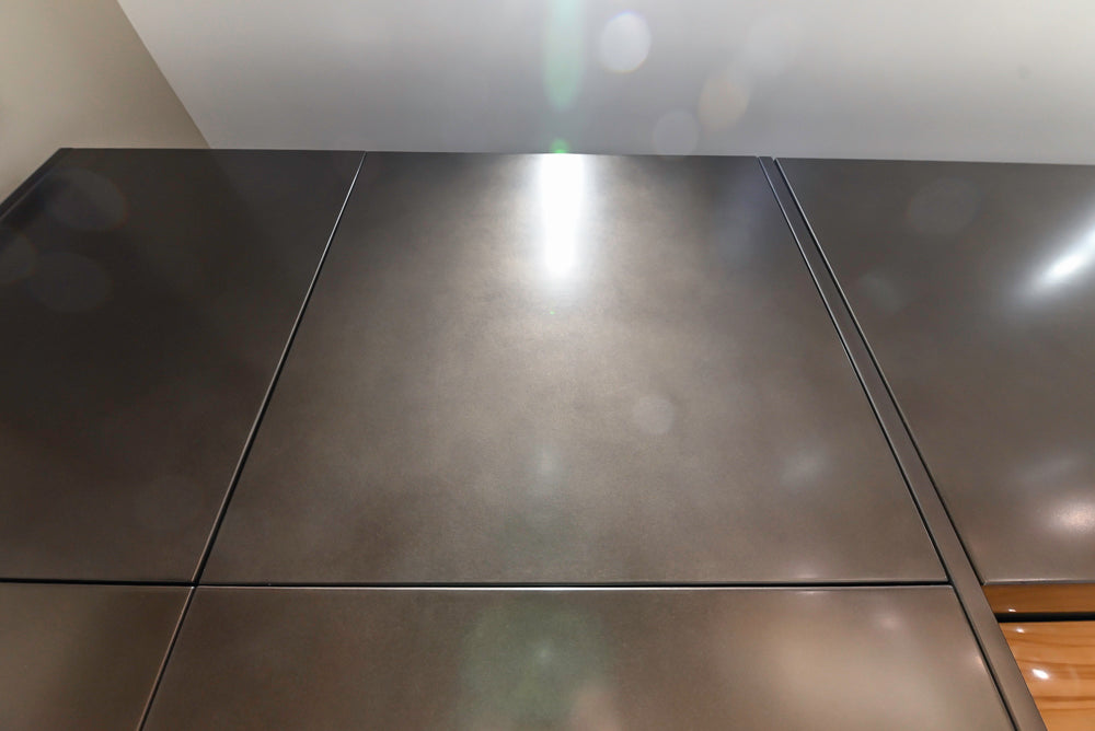 Composit Modern Brown Kitchen with Waterfall Island, Stone Countertops and Wolf & Sub-Zero Appliances