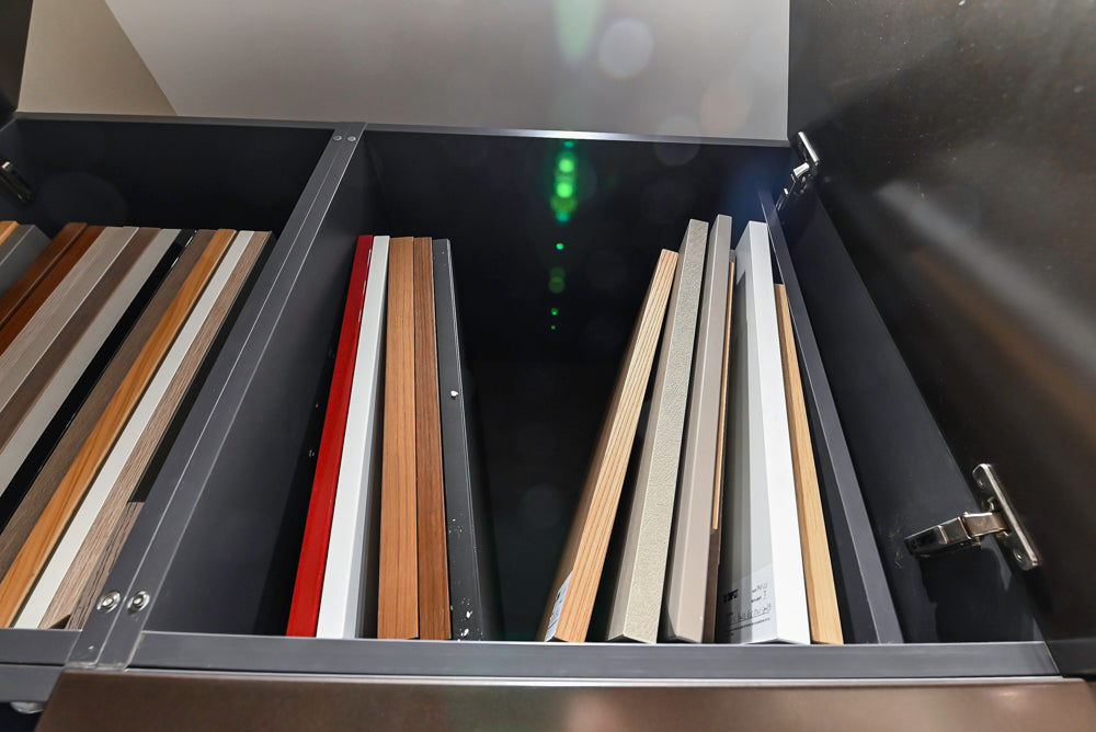 Composit Modern Brown Kitchen with Waterfall Island, Stone Countertops and Wolf & Sub-Zero Appliances