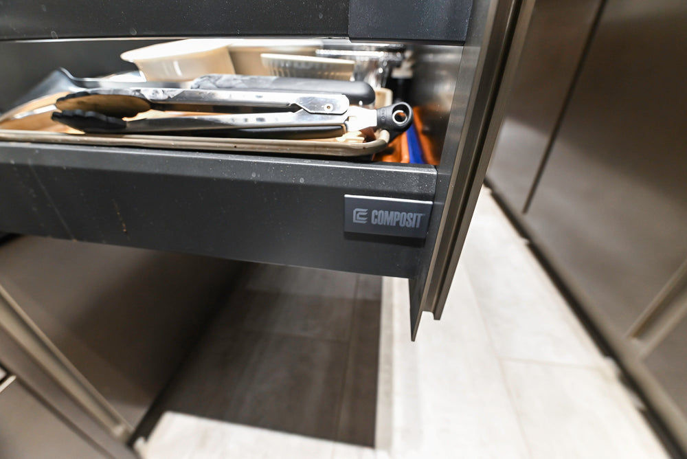 Composit Modern Brown Kitchen with Waterfall Island, Stone Countertops and Wolf & Sub-Zero Appliances