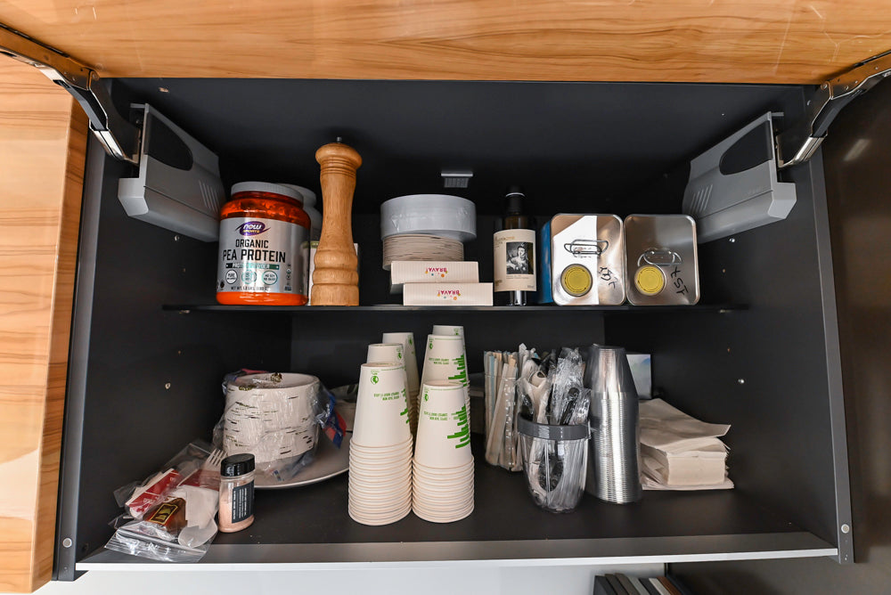 Composit Modern Brown Kitchen with Waterfall Island, Stone Countertops and Wolf & Sub-Zero Appliances