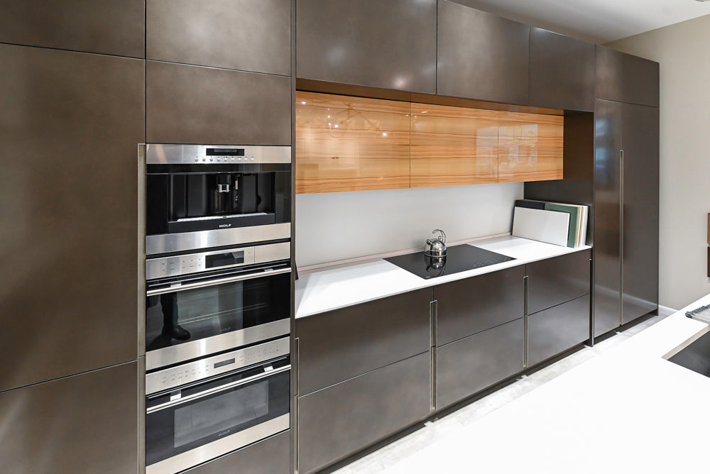 Composit Modern Brown Kitchen with Waterfall Island, Stone Countertops and Wolf & Sub-Zero Appliances
