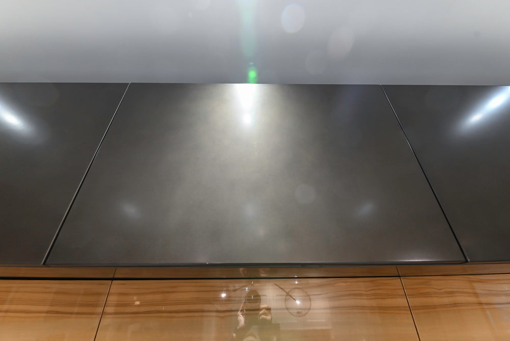 Composit Modern Brown Kitchen with Waterfall Island, Stone Countertops and Wolf & Sub-Zero Appliances