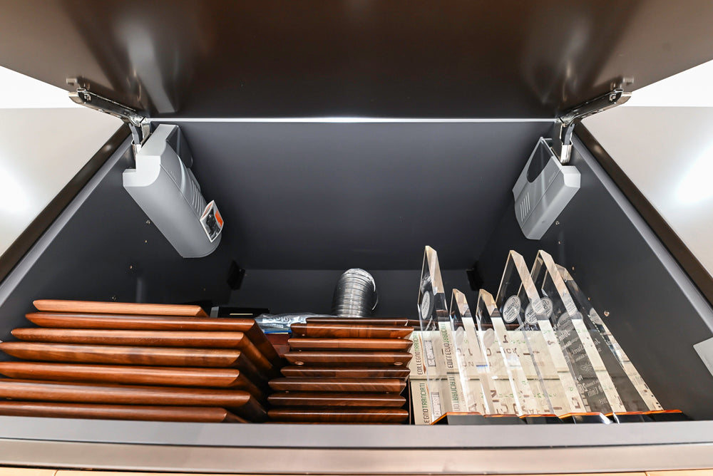 Composit Modern Brown Kitchen with Waterfall Island, Stone Countertops and Wolf & Sub-Zero Appliances