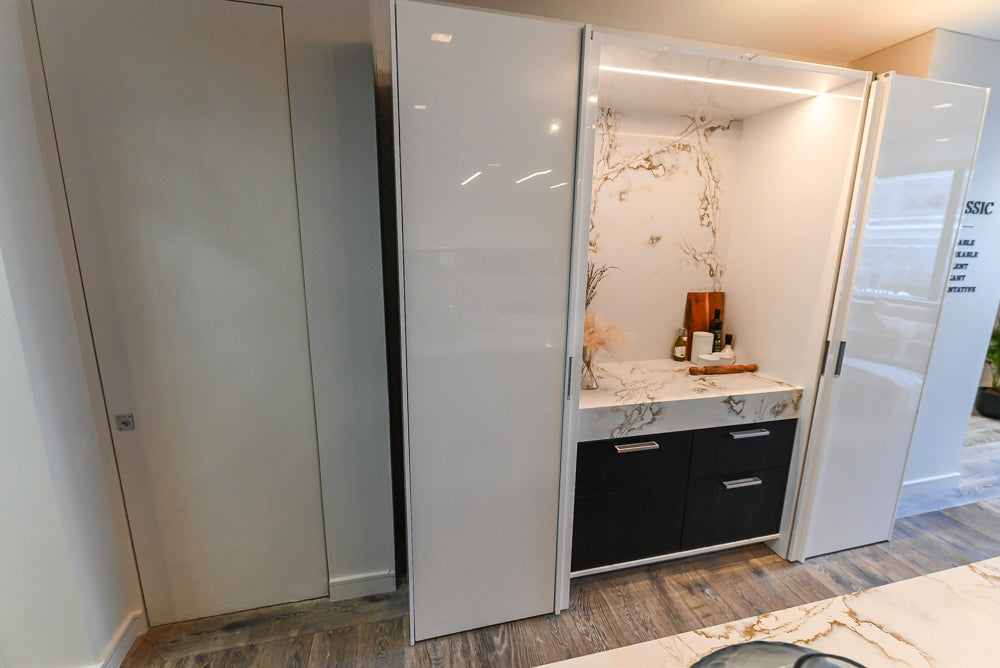 SieMatic S2 Modern Rose Gold Handleless Island with Lotus White Hideaway Pantry