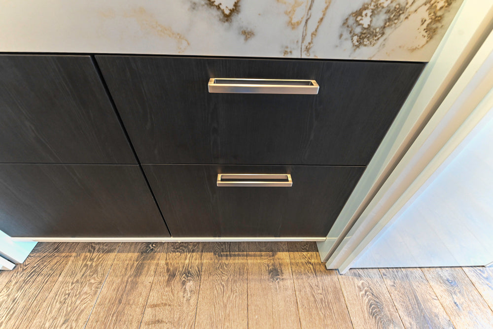 SieMatic S2 Modern Rose Gold Handleless Island with Lotus White Hideaway Pantry