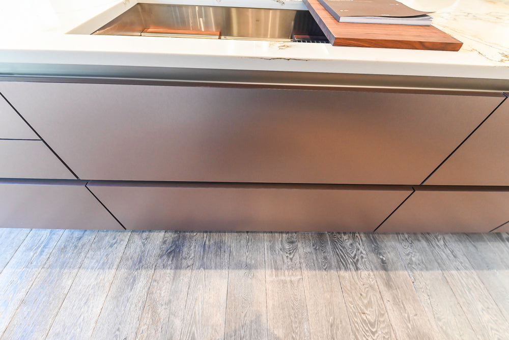 SieMatic S2 Modern Rose Gold Handleless Island with Lotus White Hideaway Pantry