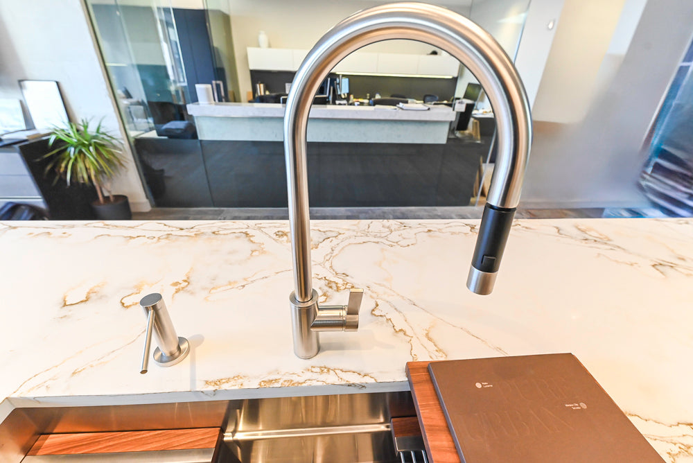 SieMatic S2 Modern Rose Gold Handleless Island with Lotus White Hideaway Pantry