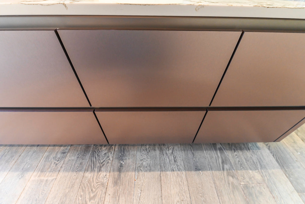 SieMatic S2 Modern Rose Gold Handleless Island with Lotus White Hideaway Pantry
