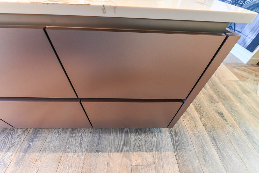 SieMatic S2 Modern Rose Gold Handleless Island with Lotus White Hideaway Pantry