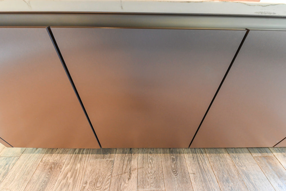 SieMatic S2 Modern Rose Gold Handleless Island with Lotus White Hideaway Pantry