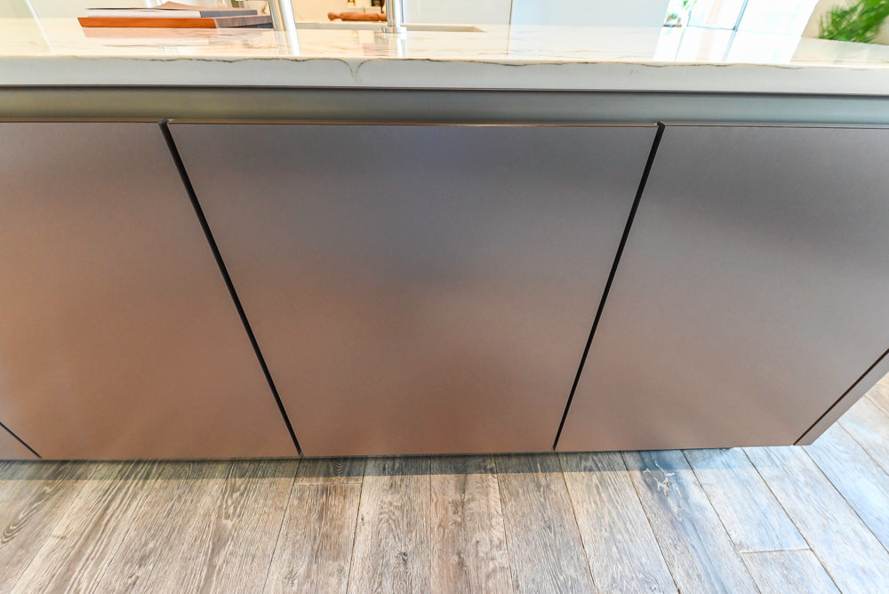 SieMatic S2 Modern Rose Gold Handleless Island with Lotus White Hideaway Pantry