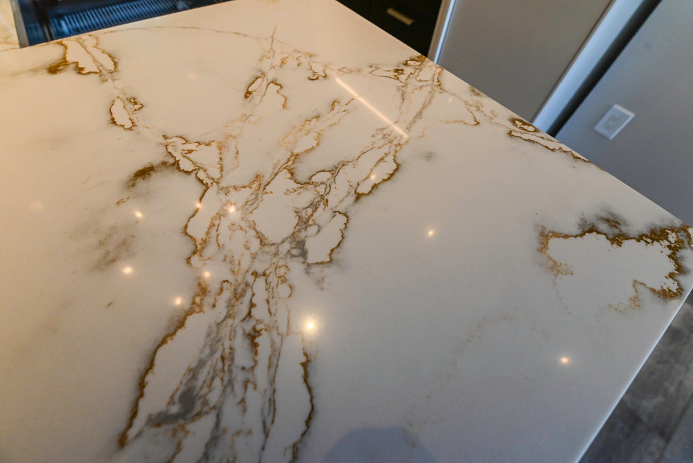 SieMatic S2 Modern Rose Gold Handleless Island with Lotus White Hideaway Pantry
