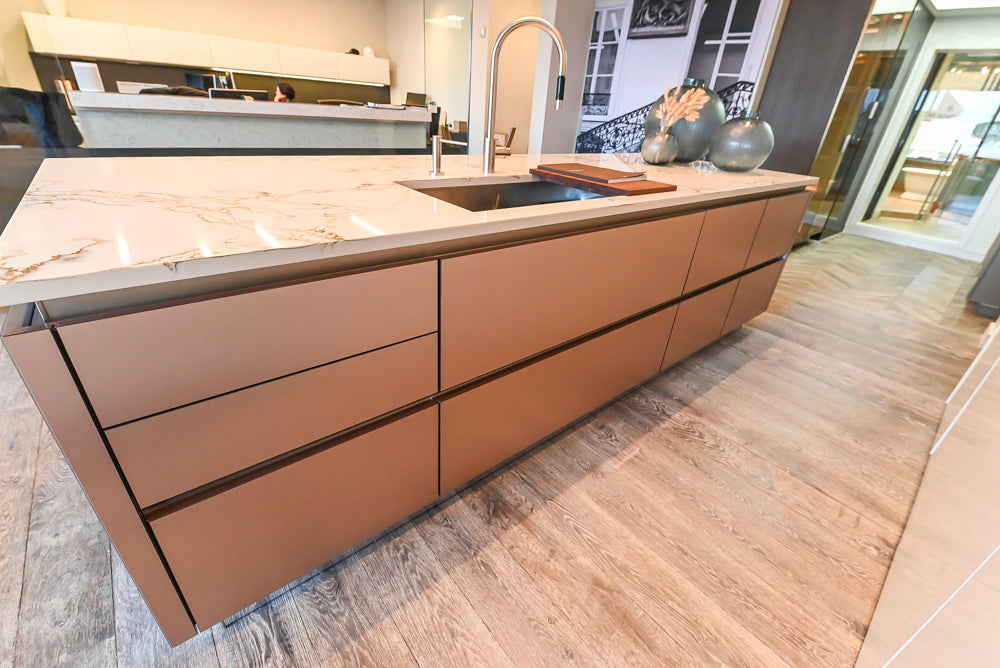 SieMatic S2 Modern Rose Gold Handleless Island with Lotus White Hideaway Pantry