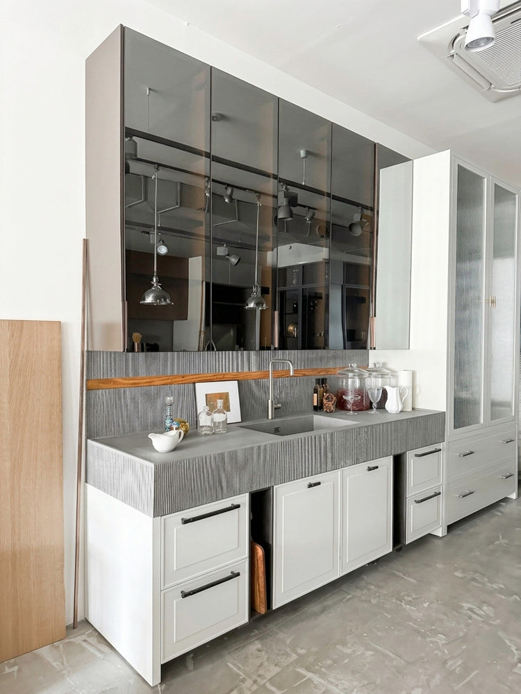 Binova modern wet bar with mirrored glass upper cabinets and sink