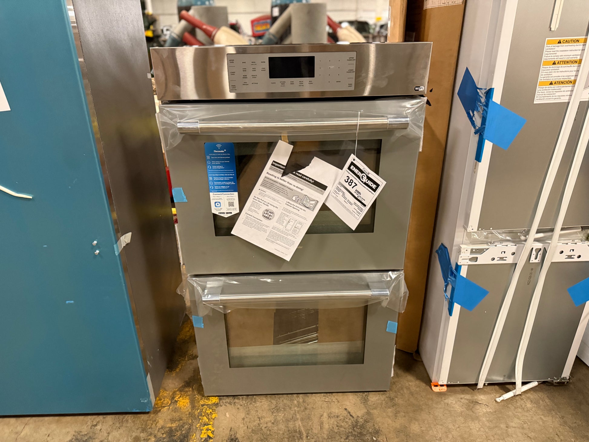 High-end Thermador double oven with Masterpiece handle and gray glass door