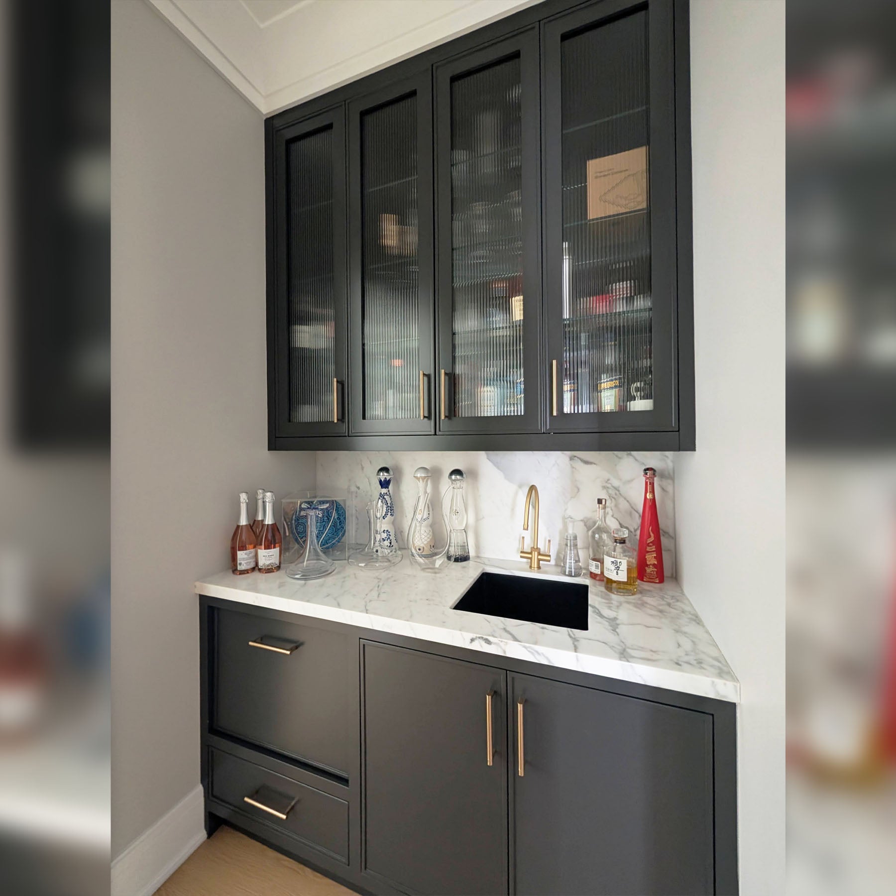 Custom Transitional Black Wet Bar with White Marble Countertops