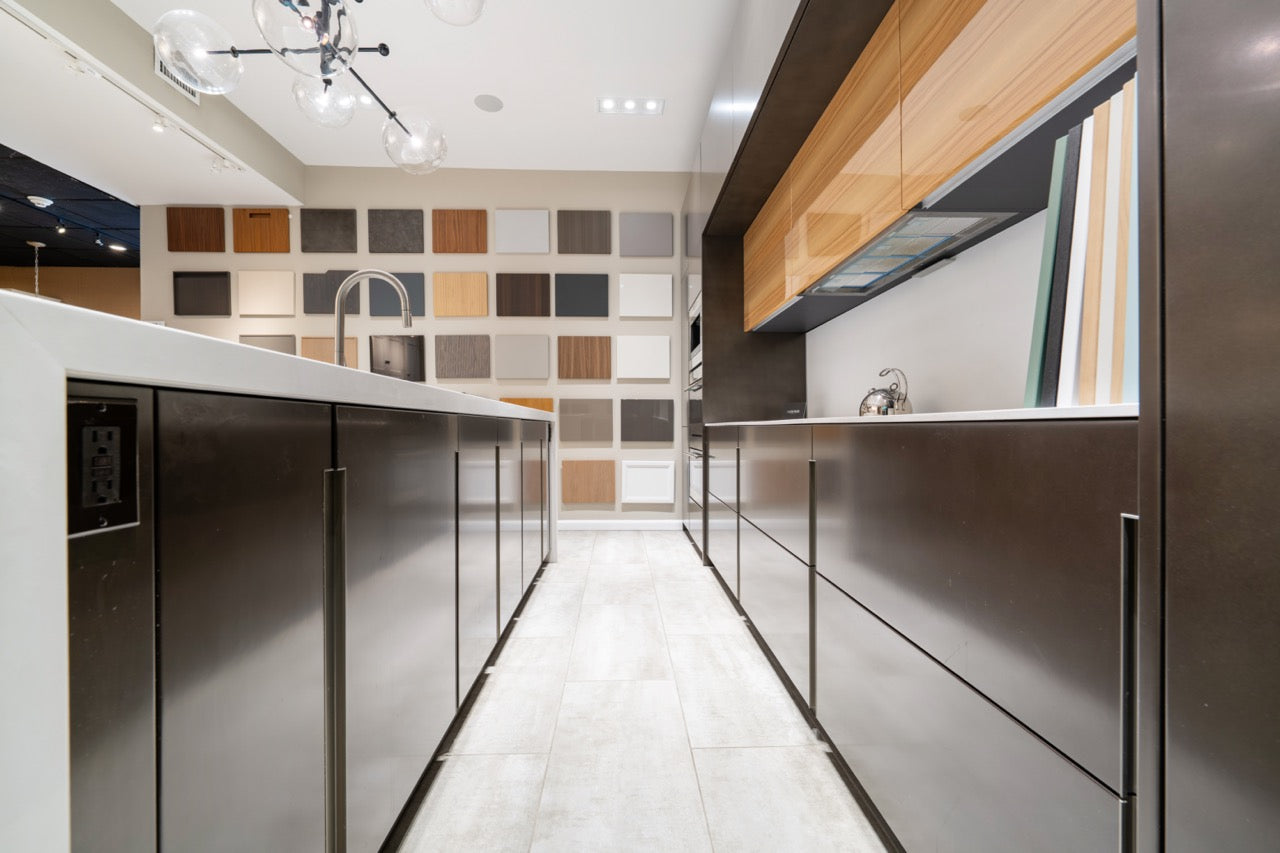 Composit Modern Brown Kitchen with Waterfall Island, Stone Countertops and Wolf & Sub-Zero Appliances
