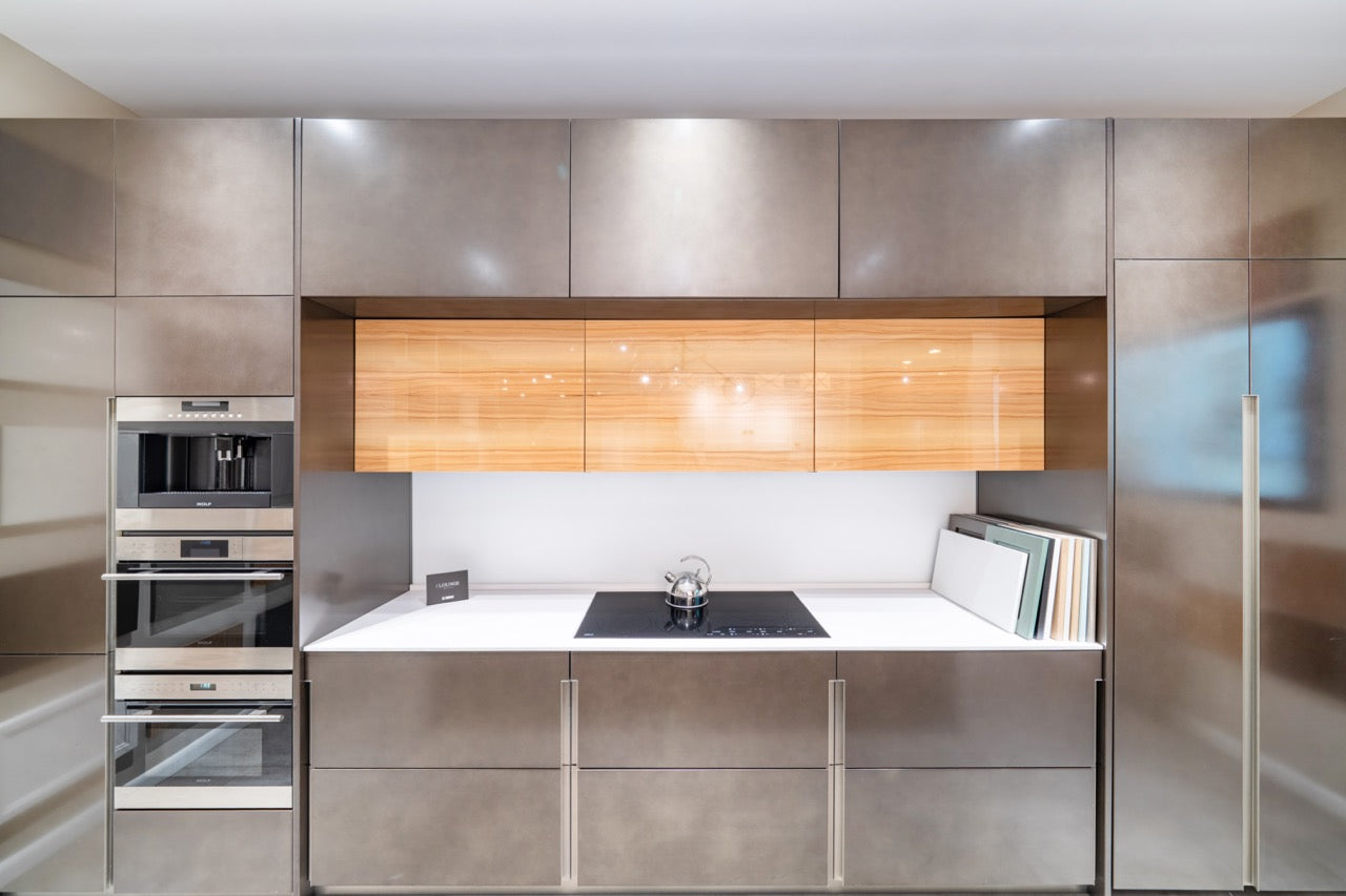 Composit Modern Brown Kitchen with Waterfall Island, Stone Countertops and Wolf & Sub-Zero Appliances