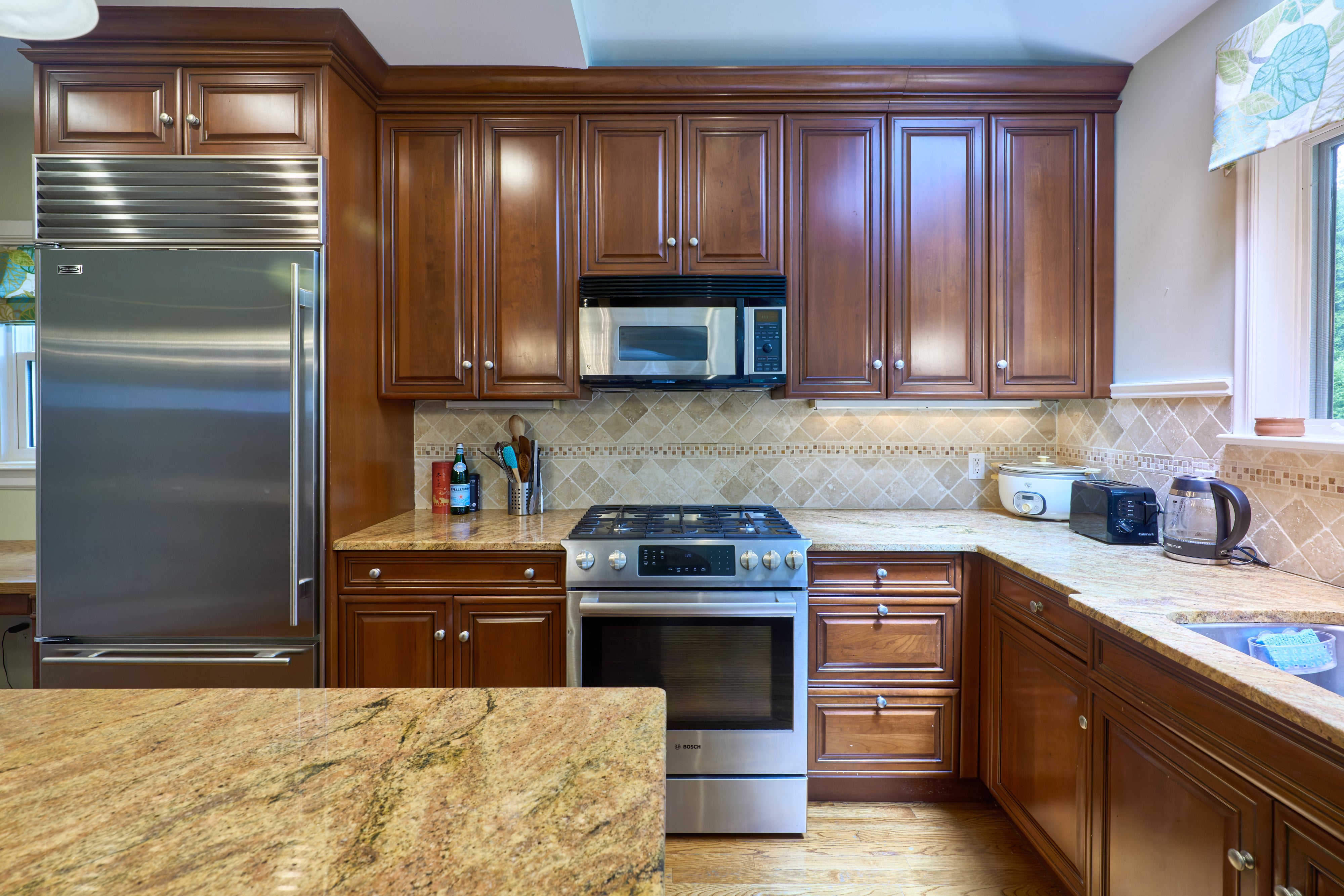 Brookhaven Traditional Wooden Kitchen with Island & Sub-Zero Refrigerator