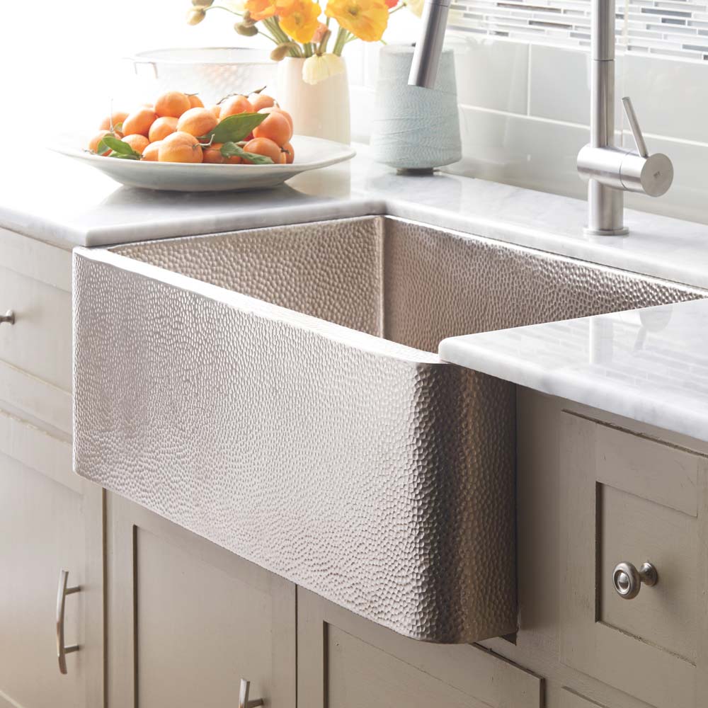 Native Trails CPK594 Farmhouse 30 kitchen sink in Brushed Nickel finish, installed in a luxury kitchen with marble countertops.