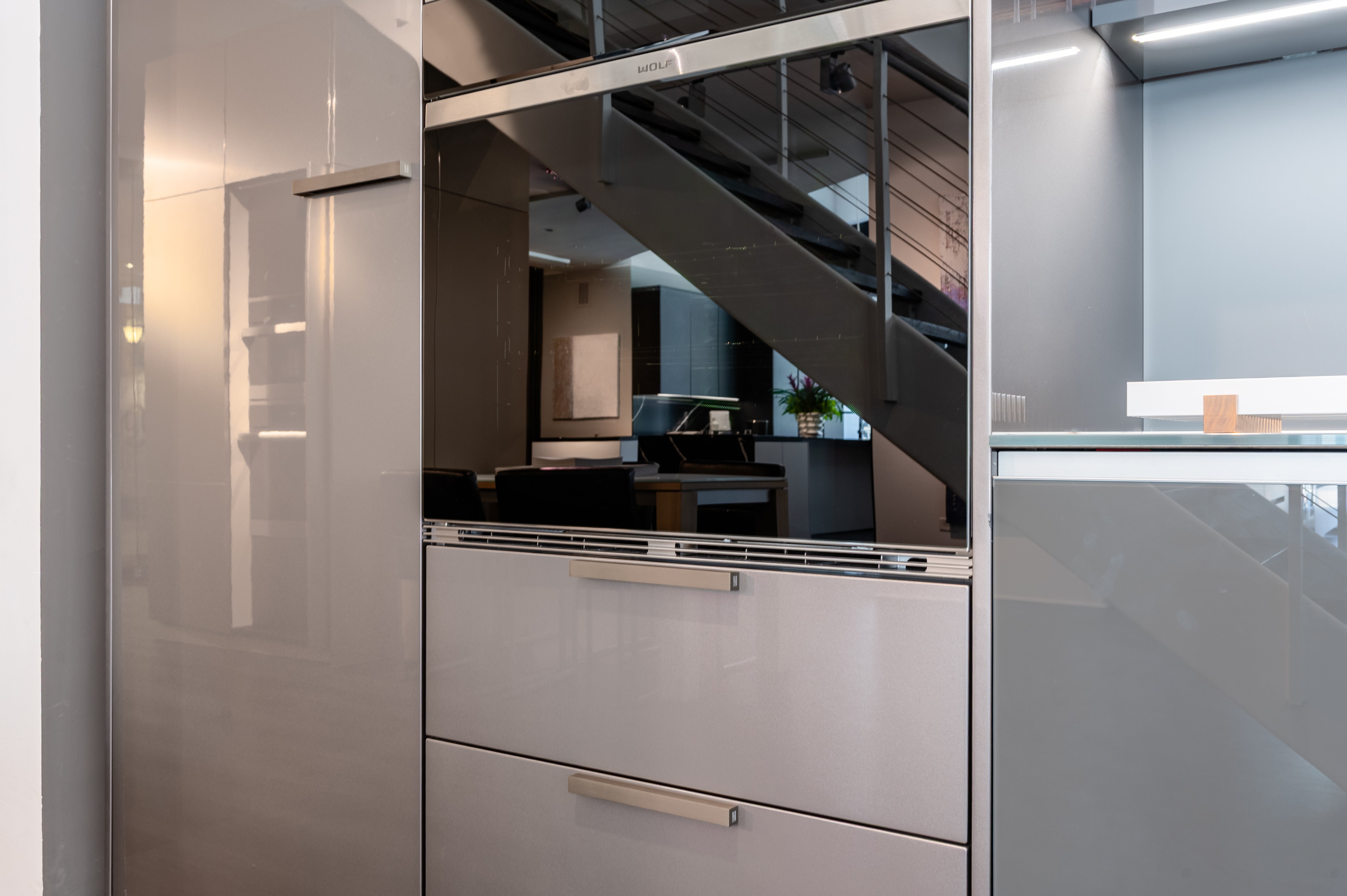 Poggenpohl Standard Modern Multi-Tone Kitchen with Glass Upper Cabinets and Sub-Zero & Wolf Appliances