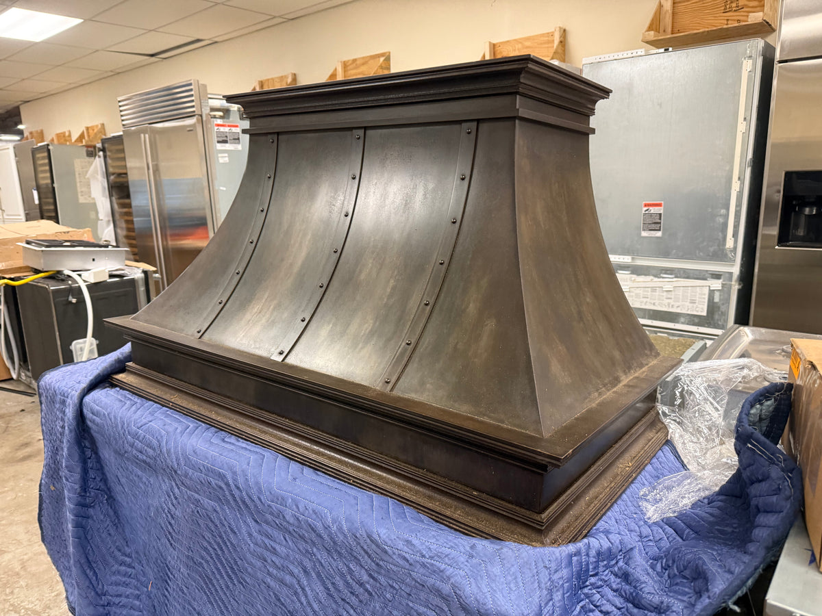 Custom artisan metal and cast iron kitchen range hood surround canopy
