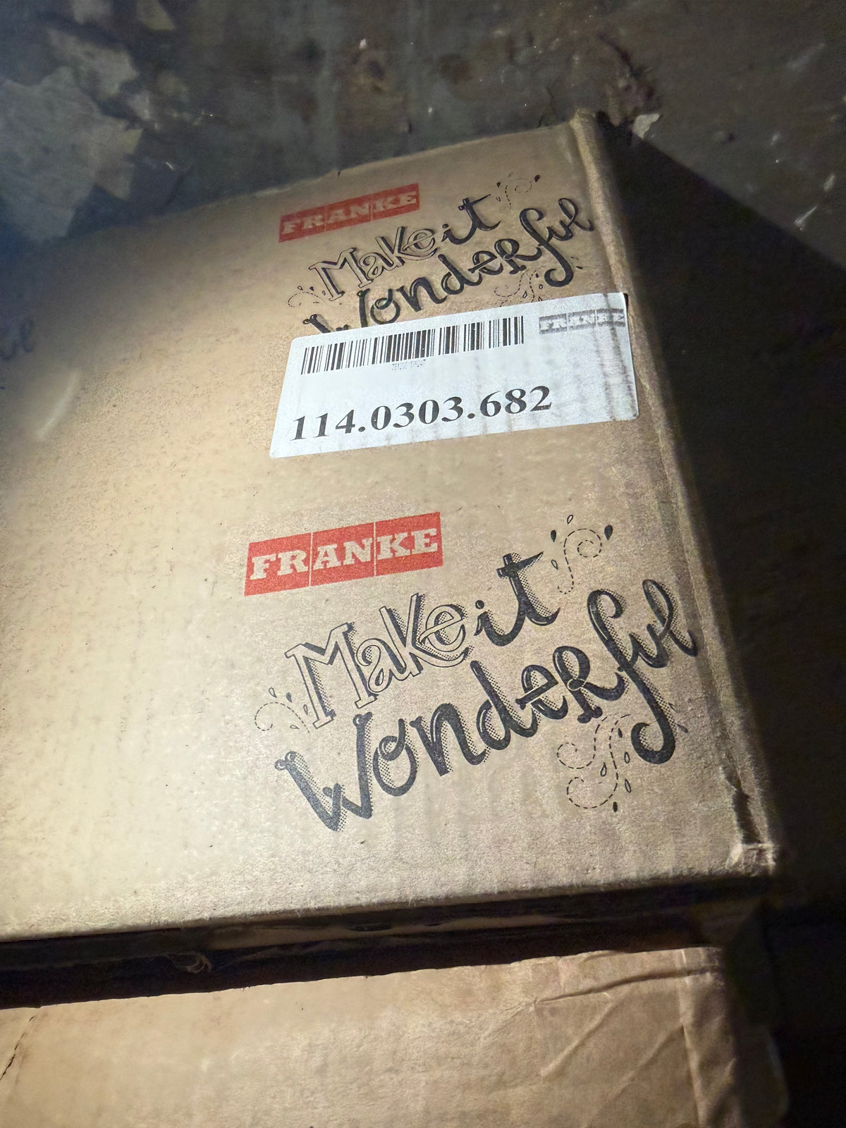 A brown cardboard shipping box with a white shipping label and printed text reading 'Make it Wonderful' and the brand name 'FRANKE'.