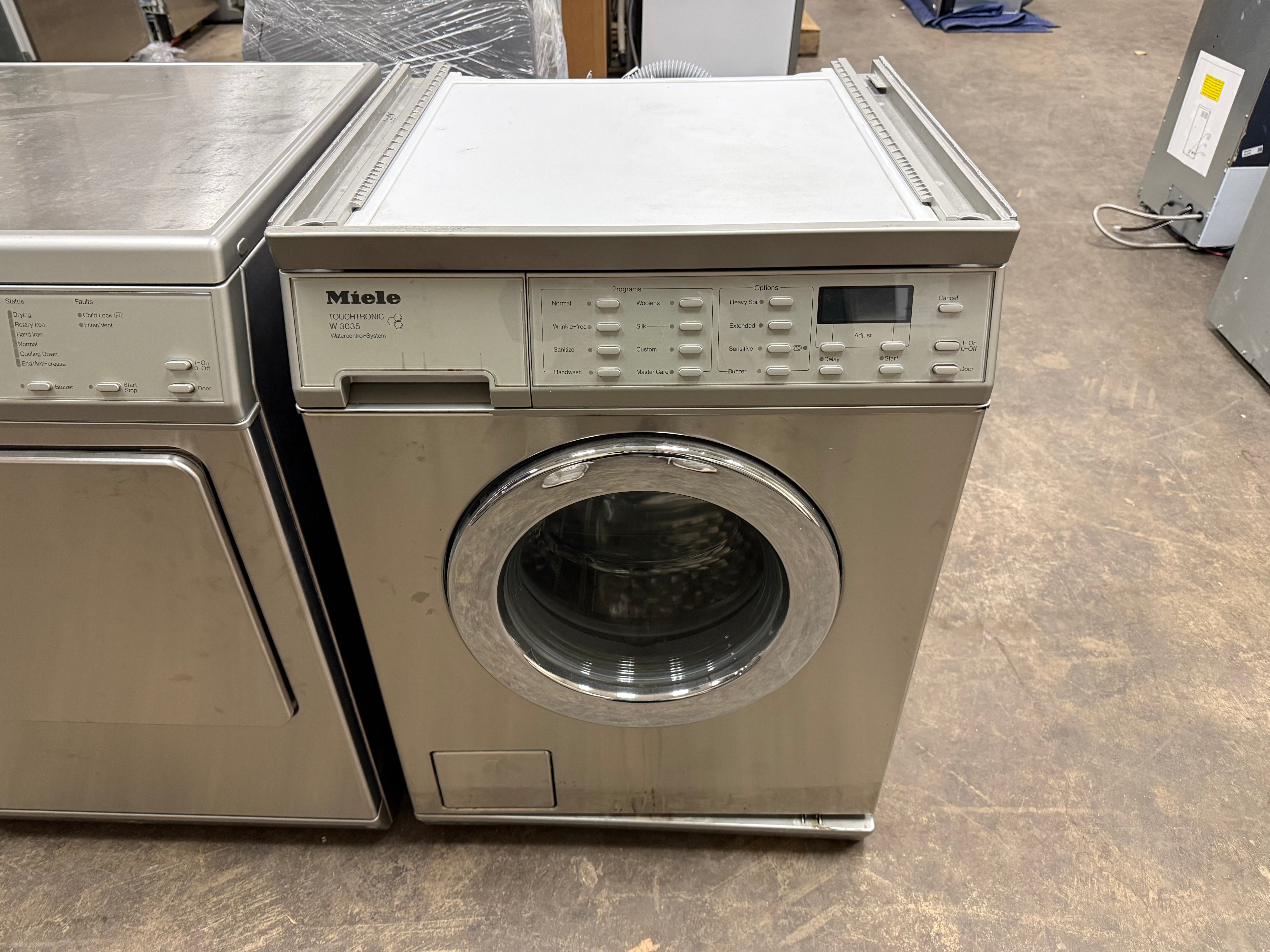 Compact Miele professional laundry suite in a stainless steel finish