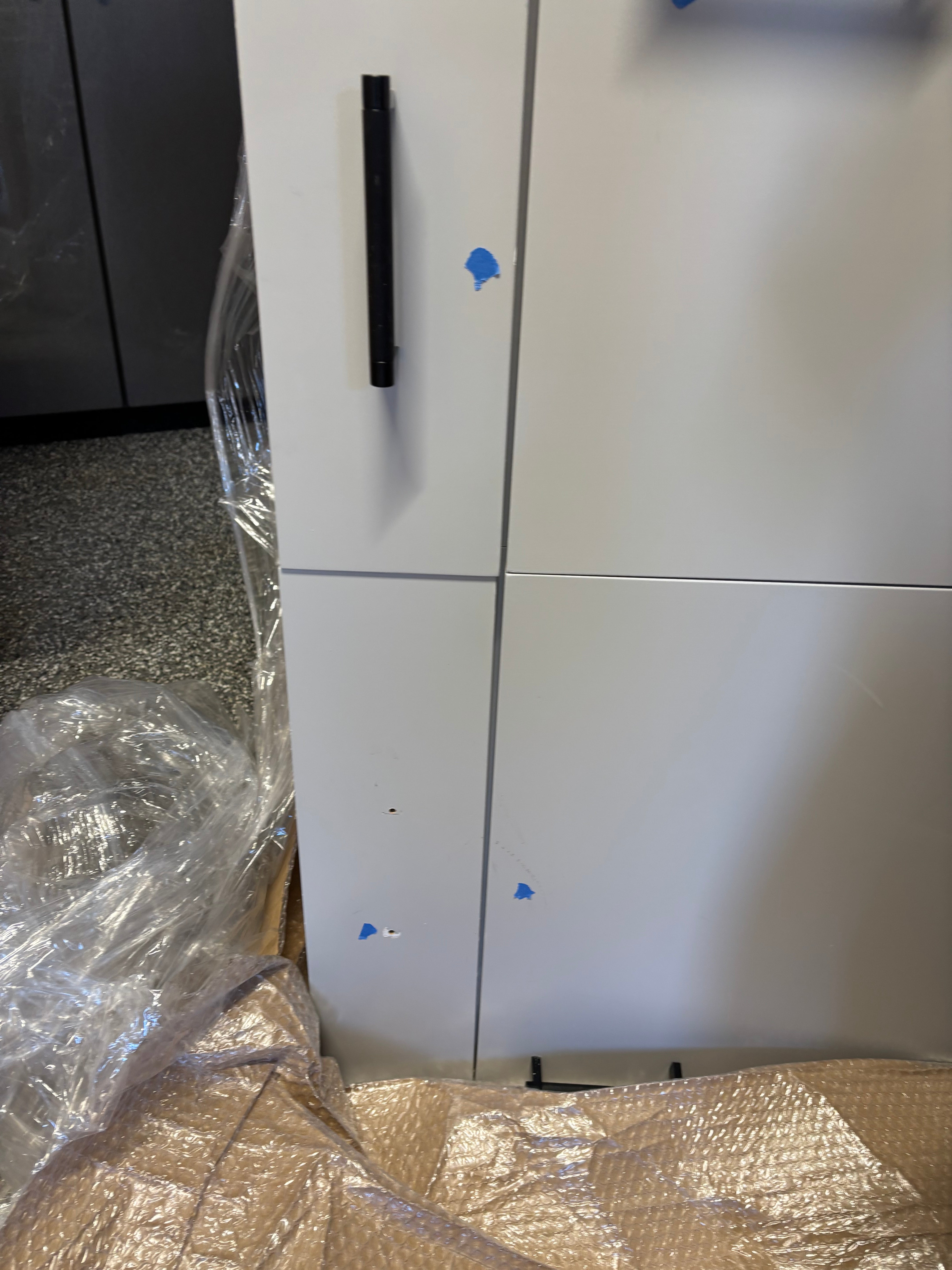 Custom Modern Light Grey Pantry with White Stone Countertops and Stainless Steel Sink