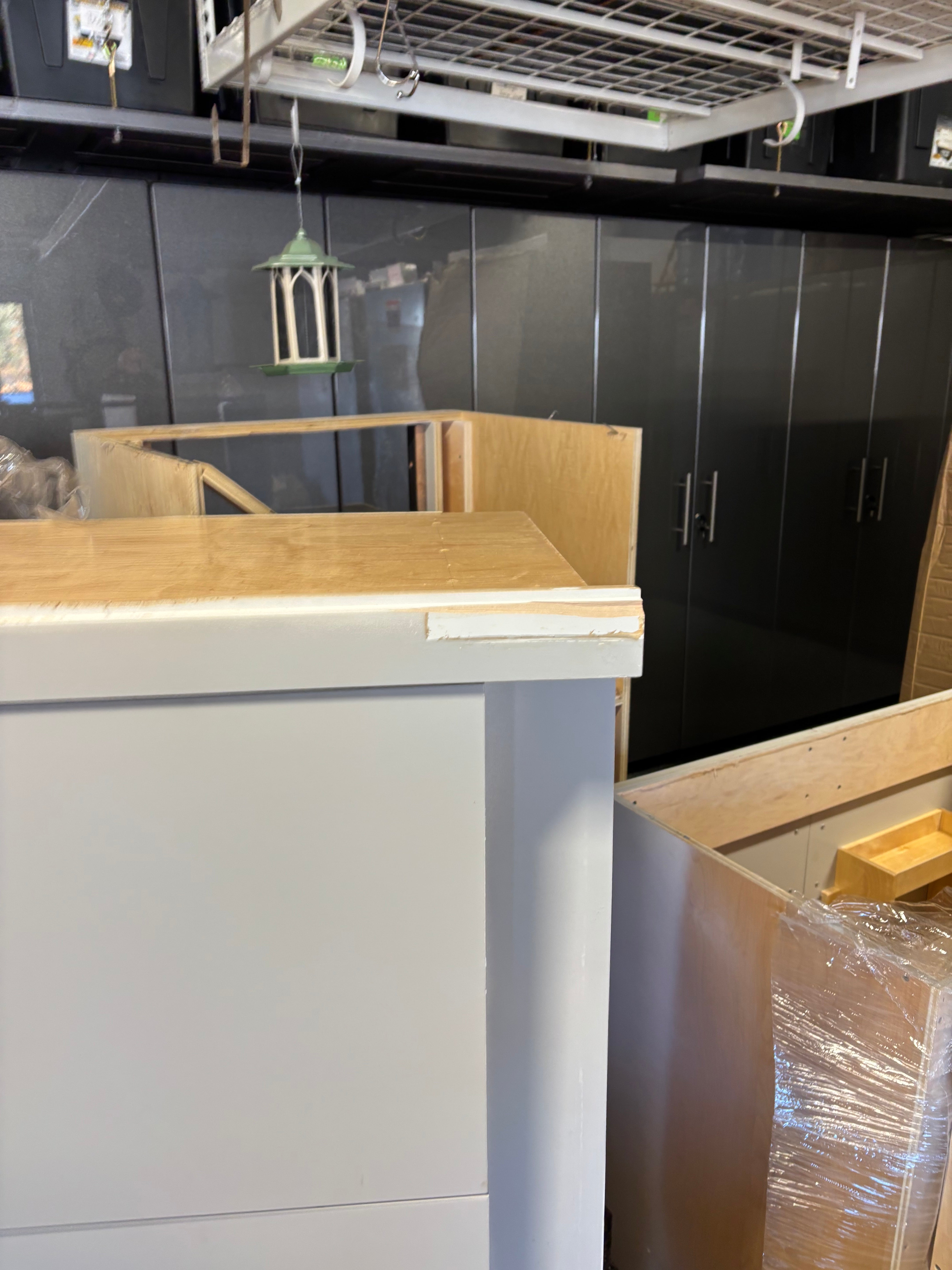 Custom Modern Light Grey Pantry with White Stone Countertops and Stainless Steel Sink