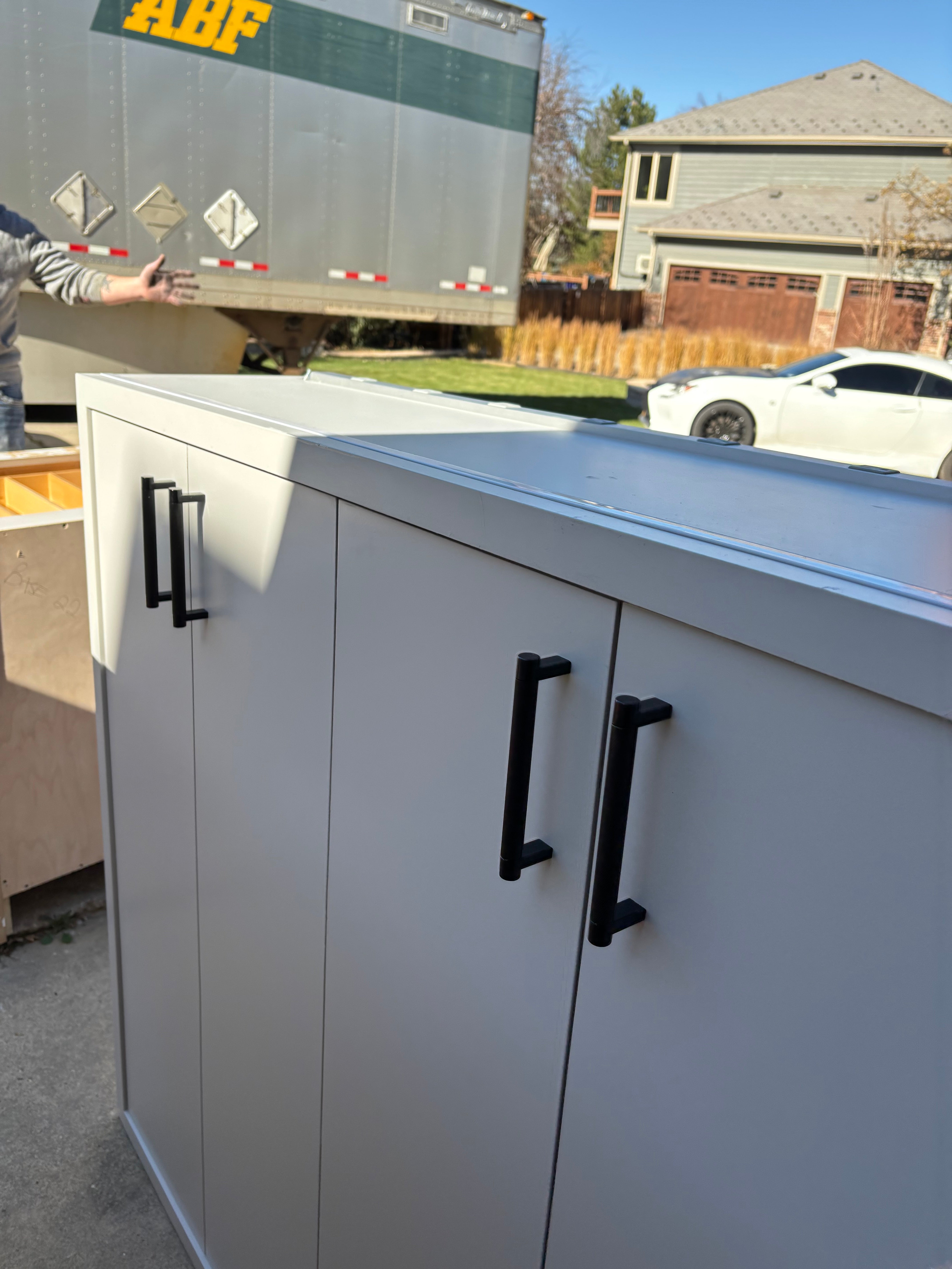 Custom Modern Light Grey Pantry with White Stone Countertops and Stainless Steel Sink