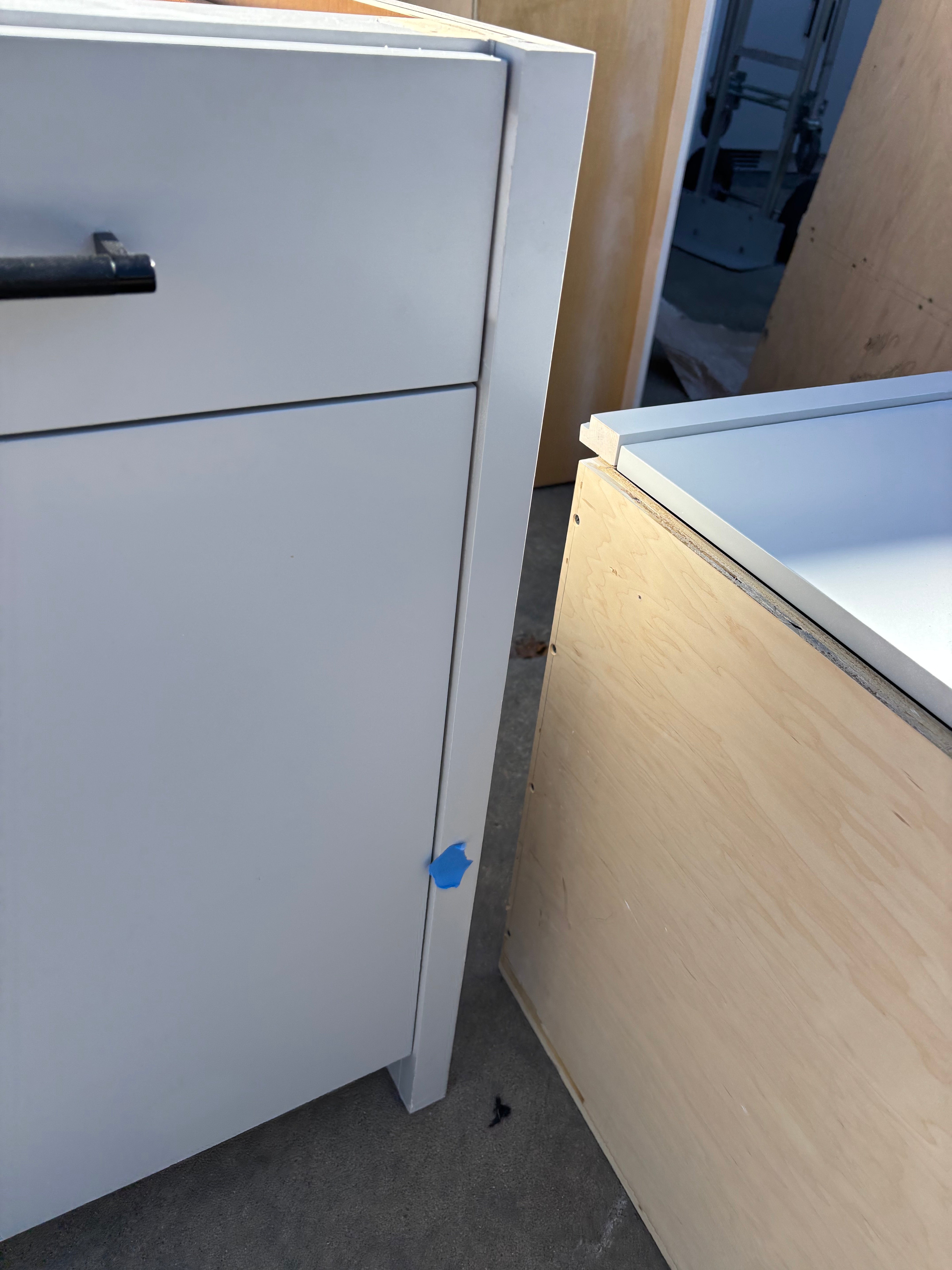 Custom Modern Light Grey Pantry with White Stone Countertops and Stainless Steel Sink