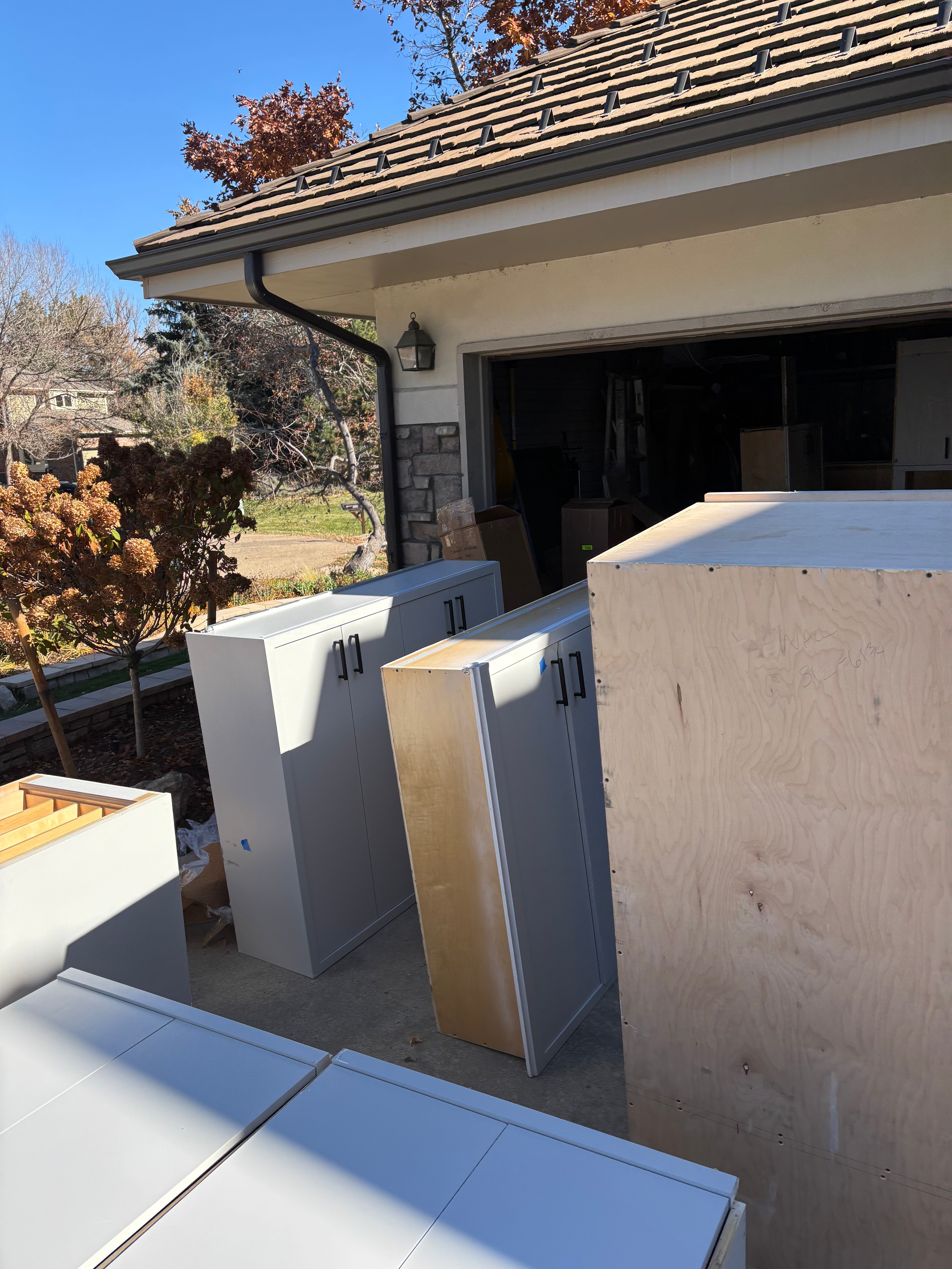 Custom Modern Light Grey Pantry with White Stone Countertops and Stainless Steel Sink
