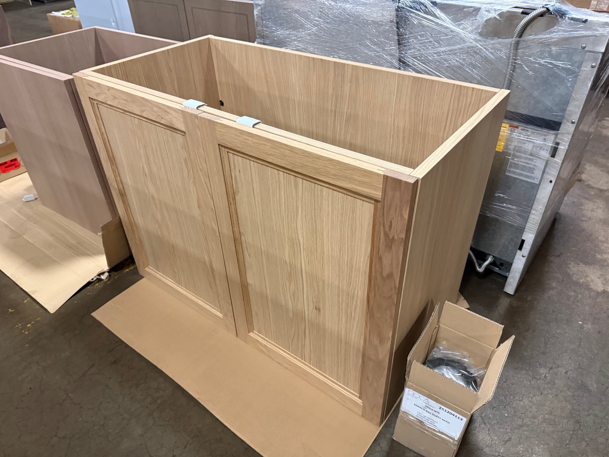 Close up view of the pale natural oak wood grain finish and soft close drawer pull detail on the DOCA 47 inch vanity