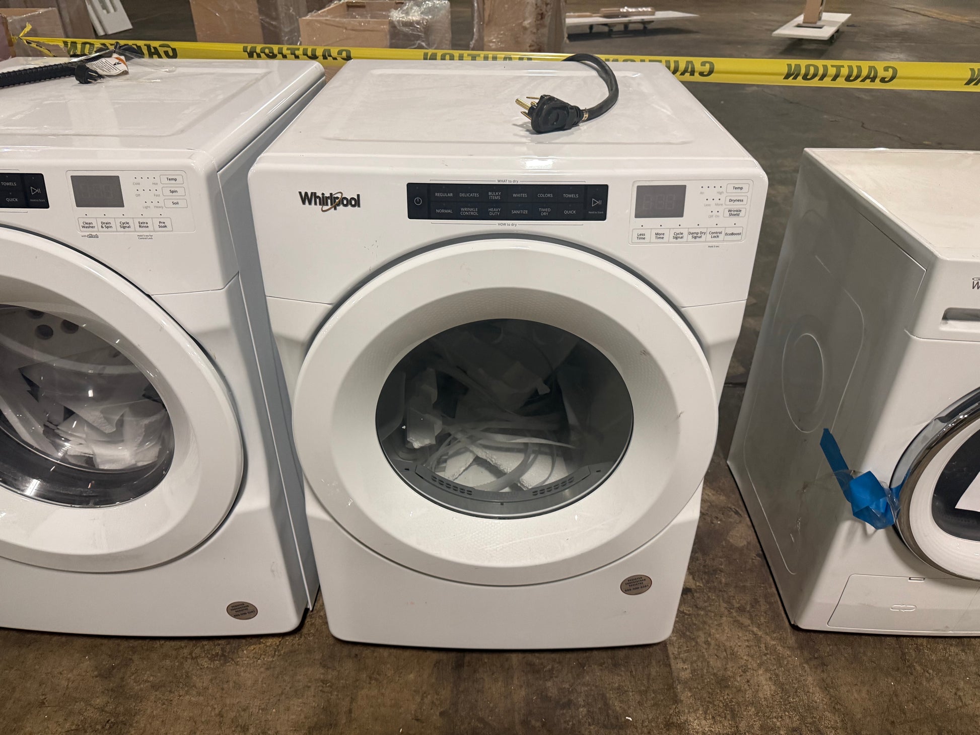 Close-up of the clean white front control panel and digital display of the Whirlpool WED560LHW electric dryer