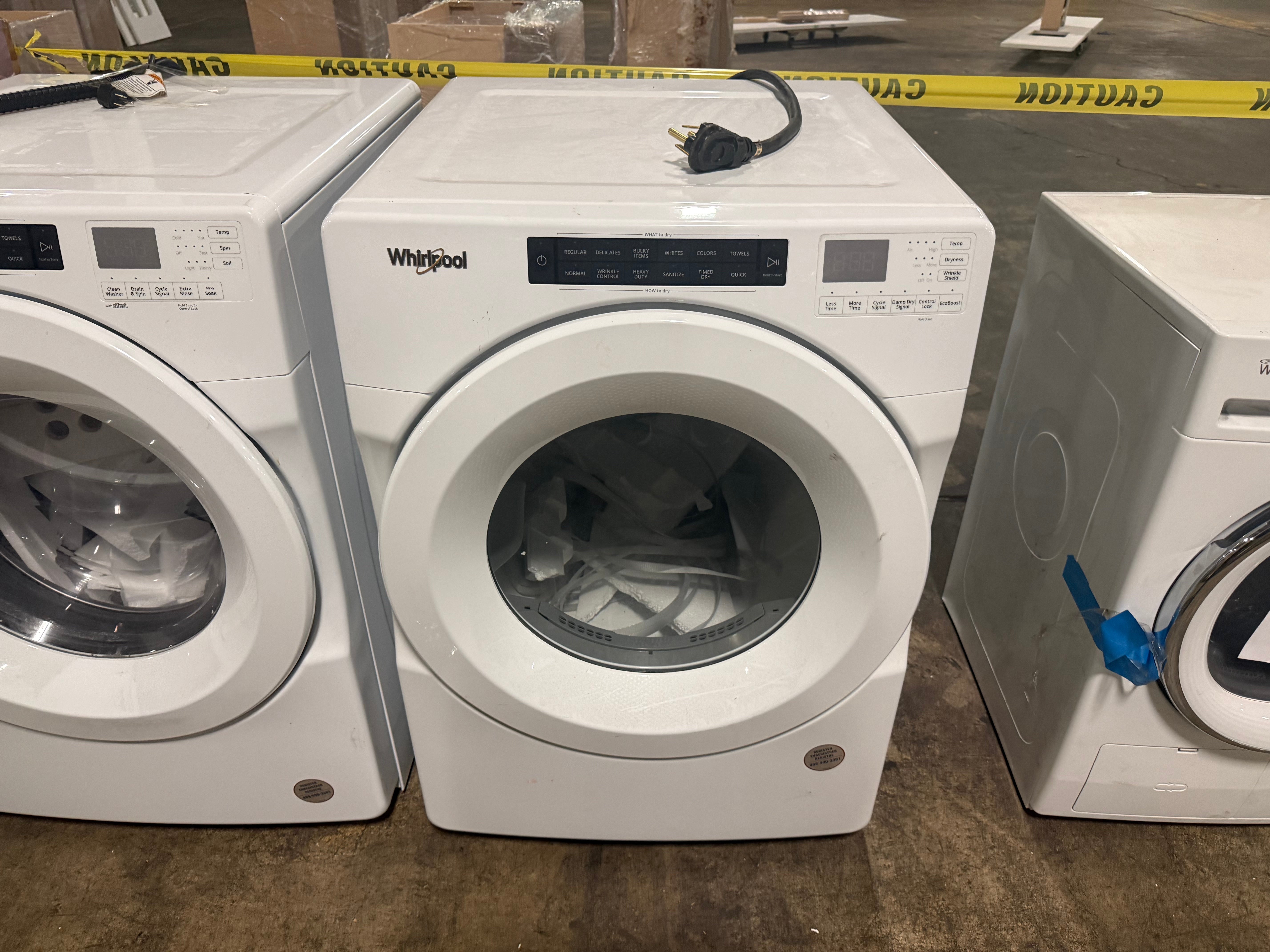 Close-up of the clean white front control panel and digital display of the Whirlpool WED560LHW electric dryer