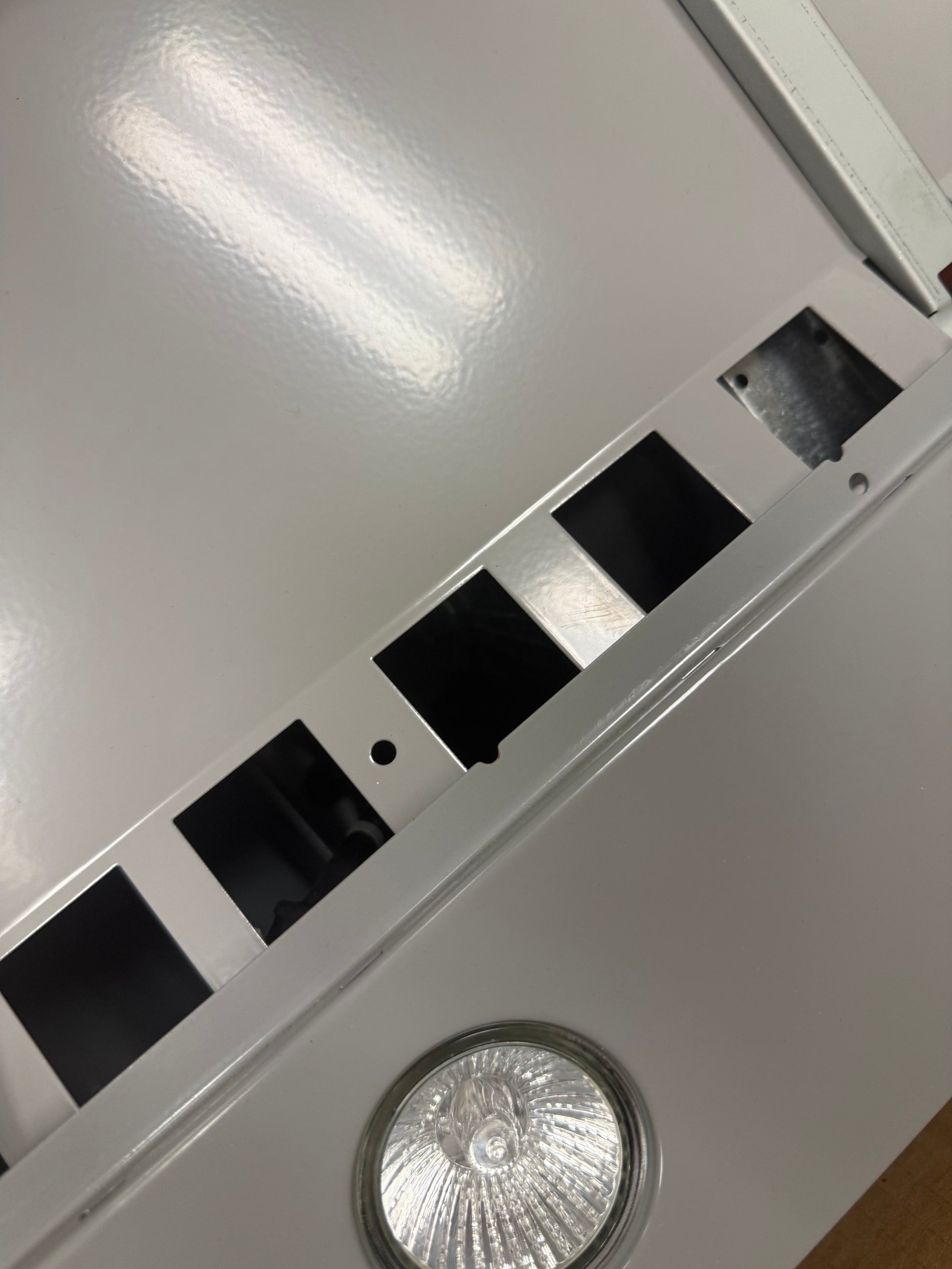 Close up of XO XOC30SMUA retracting slide out visor and illuminated controls